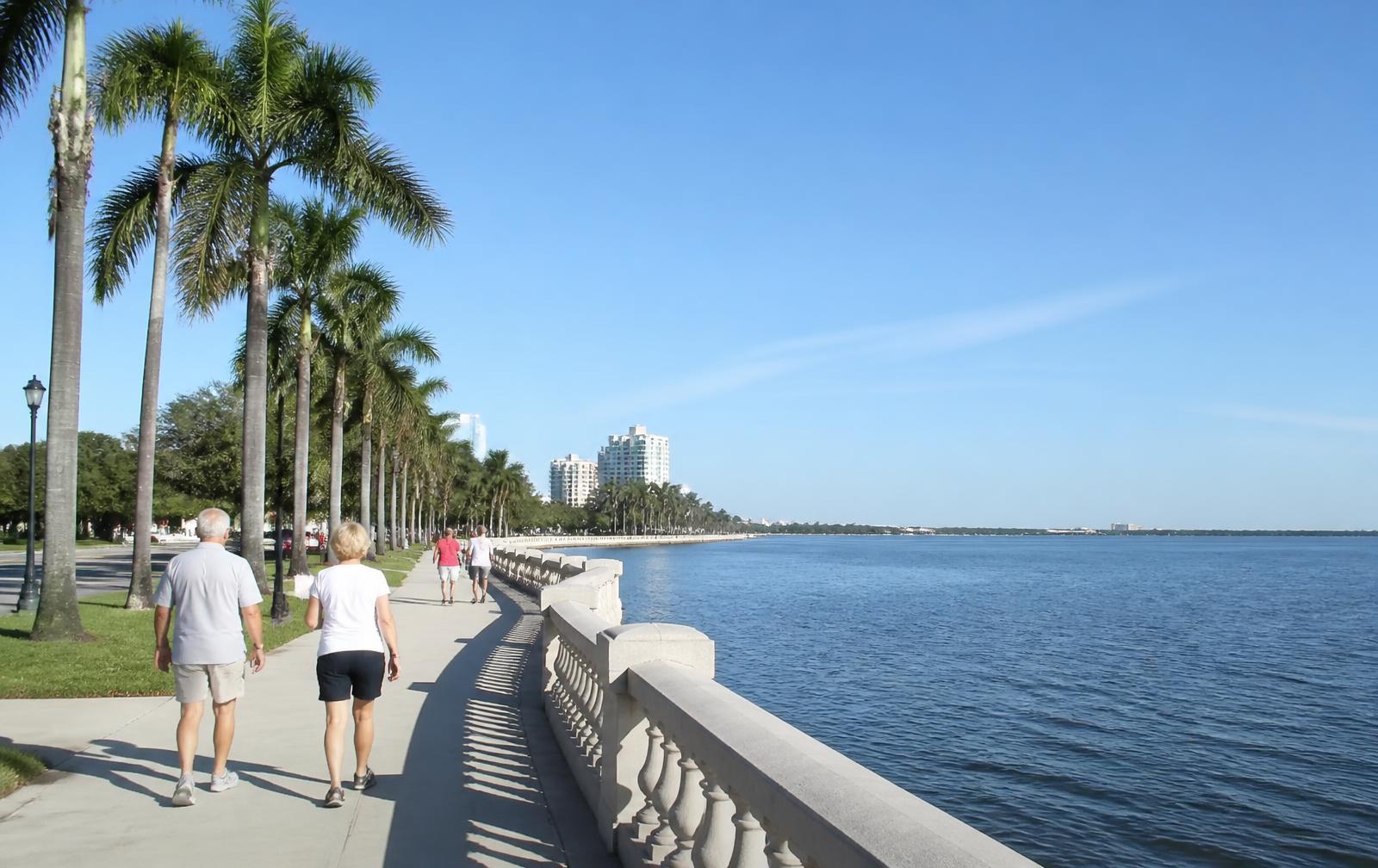 Downtown Tampa skyline along the Riverwalk near Amalie Arena at dusk
